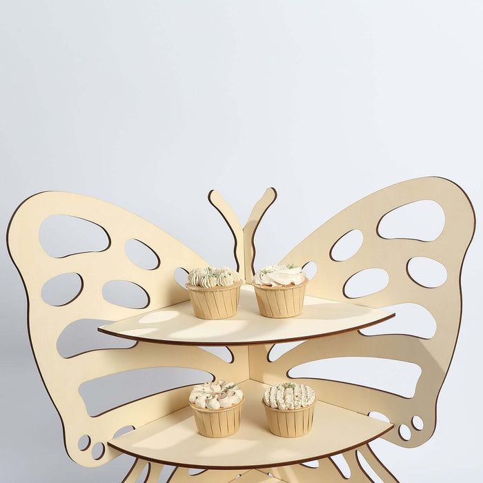 Butterfly-shaped cupcake stand with four cupcakes displayed on a white background.