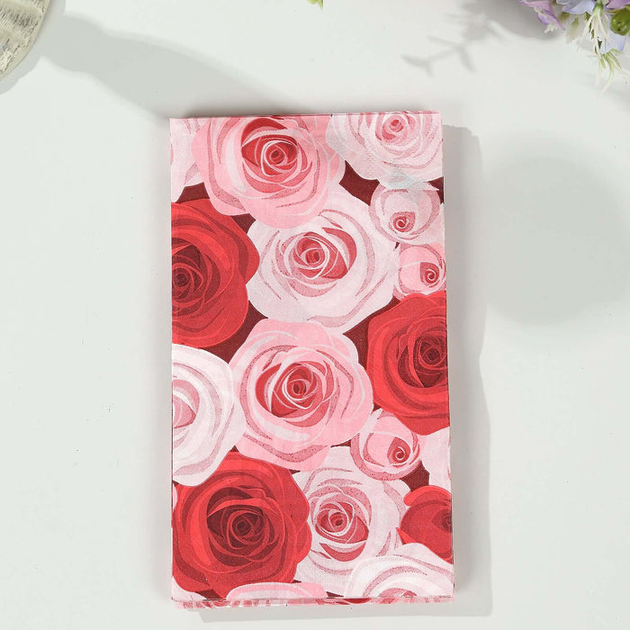 Floral fabric featuring pink and red roses on a white background