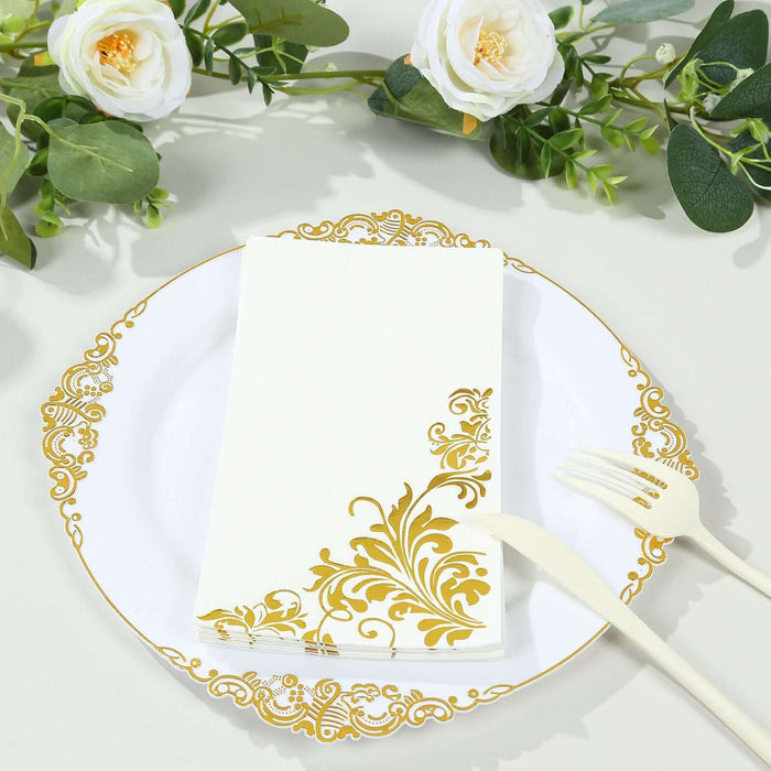 Elegant gold-accented napkin on a decorative plate with floral elements.