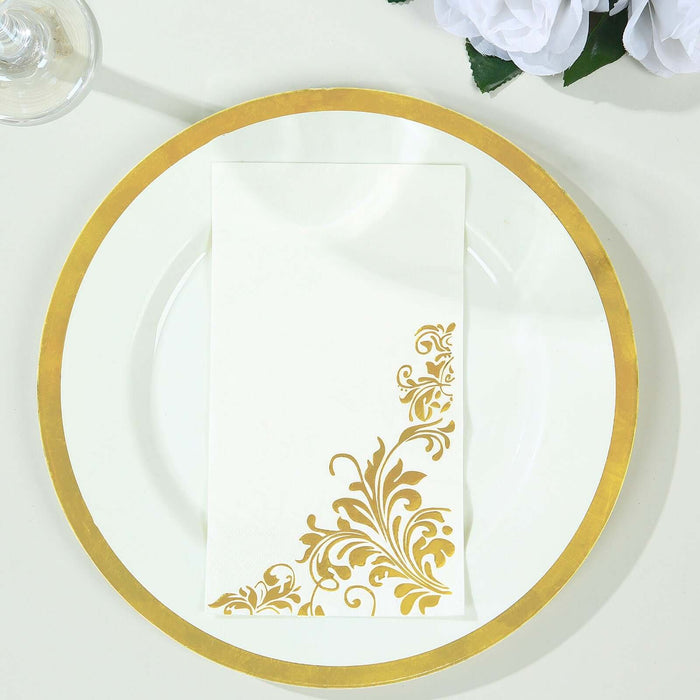 Elegant gold-patterned napkin on a white plate.