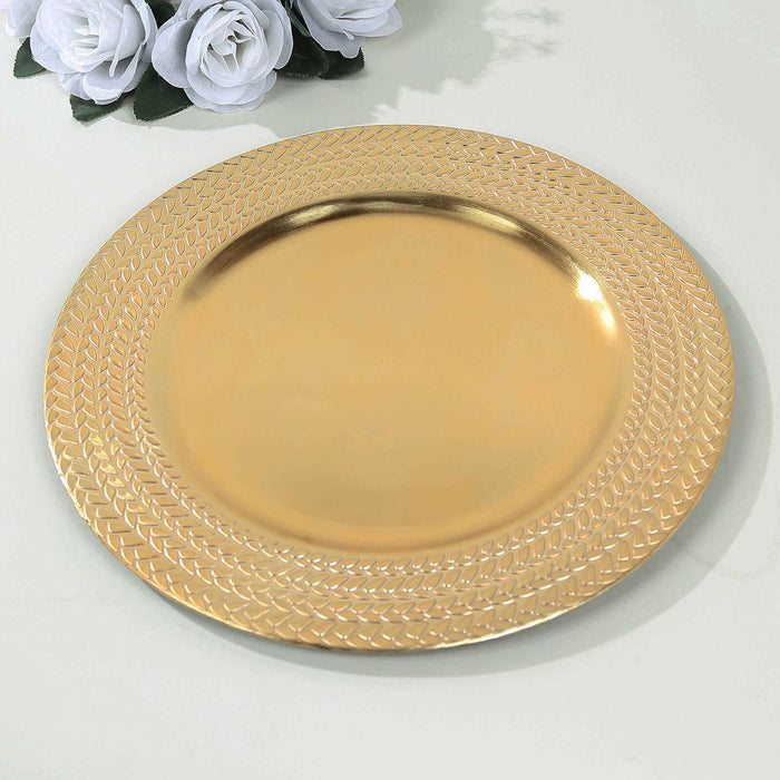 Gold decorative plate with textured rim on a plain surface.