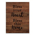 Cream script reading Bless Your Heart Bless This Home on dark walnut wood.