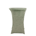 Green textured side table with a unique shape