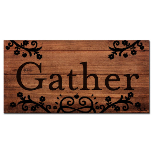 Carved cream Gather lettering on warm brown wood planks.