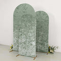 Three green textured backdrop panels with floral accents.