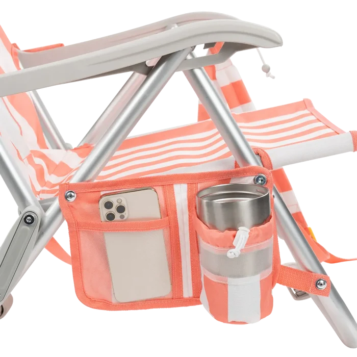 Close-up of the phone pocket and beverage holder on the SideKick lounger in coral stripes.